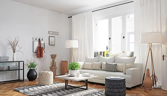 Modern living room with large windows and cozy furniture, promoting cash purchases of rental properties in Spokane, WA.