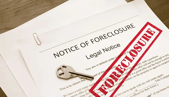 House exterior with a foreclosure notice for distressed property buying in Twin Falls, ID.